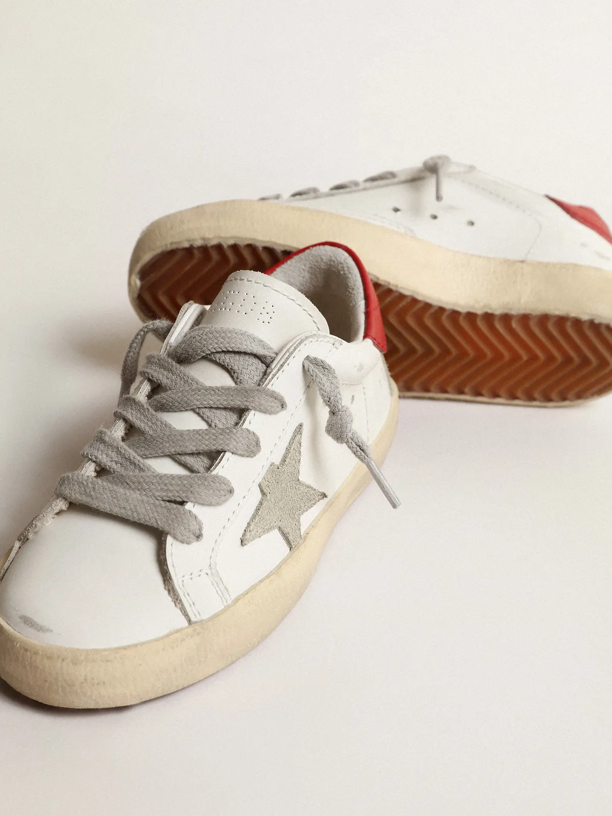 Super-Star Junior with suede star and red leather heel tab